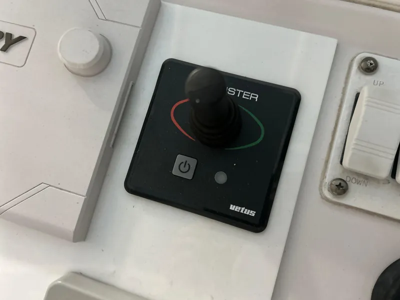 Slide: The Image of Control panel of a 2007 Donzi 38 ZF Cuddy boat with joystick and switches. - 11