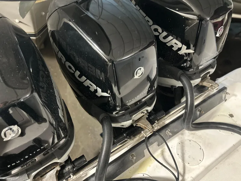 Slide: The Image of Triple Mercury outboard engines on a 2007 Donzi 38 ZF Cuddy boat. - 12