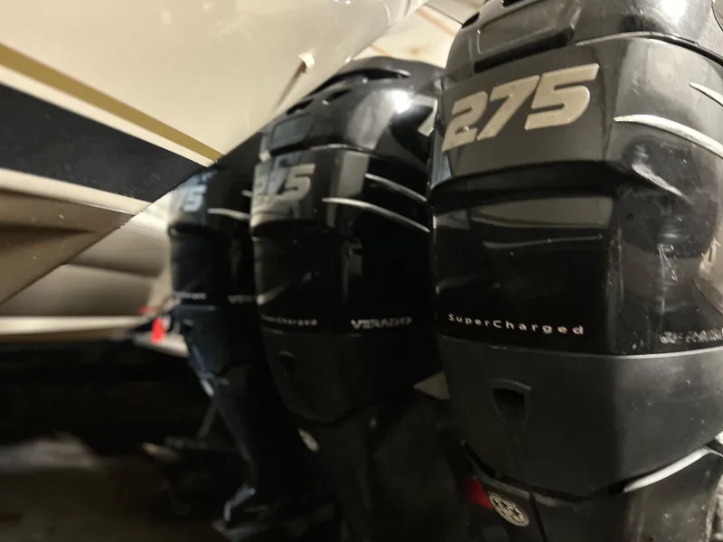 Slide: The Image of Triple 275 horsepower supercharged engines on a 2007 Donzi 38 ZF Cuddy boat. - 13