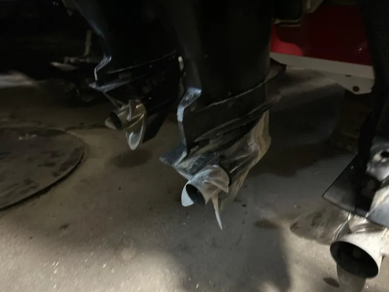 Slide: The Image of Propellers of a 2007 Donzi 38 ZF Cuddy boat in a dimly lit setting. - 16