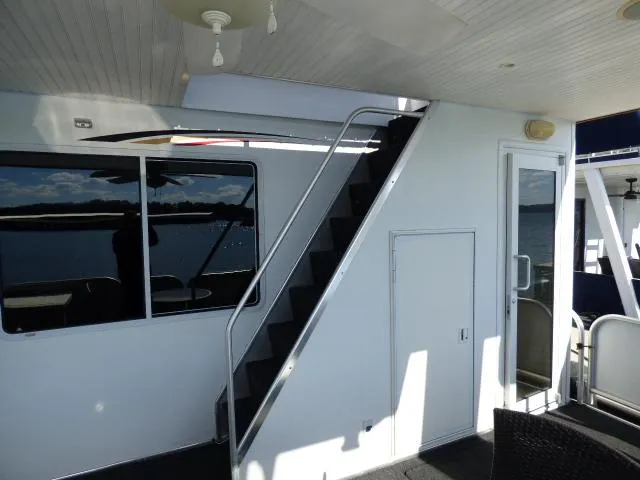 Slide: The Image of Staircase on 2006 Thoroughbred 20x90 houseboat interior with window and door. - 15