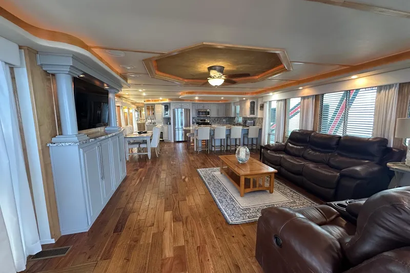 Slide: The Image of Luxurious 2006 Thoroughbred 20x90 houseboat interior with elegant furnishings and hardwood flooring. - 2
