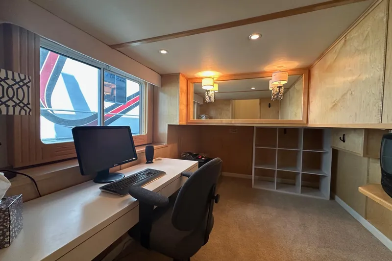 Slide: The Image of Modern office space in a 2006 Thoroughbred 20x90, featuring a desk and computer setup. - 8