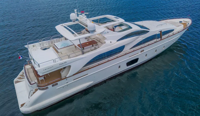 Slide: The Image of Luxury 2006 Azimut 105 Grande yacht cruising on open water. - 1