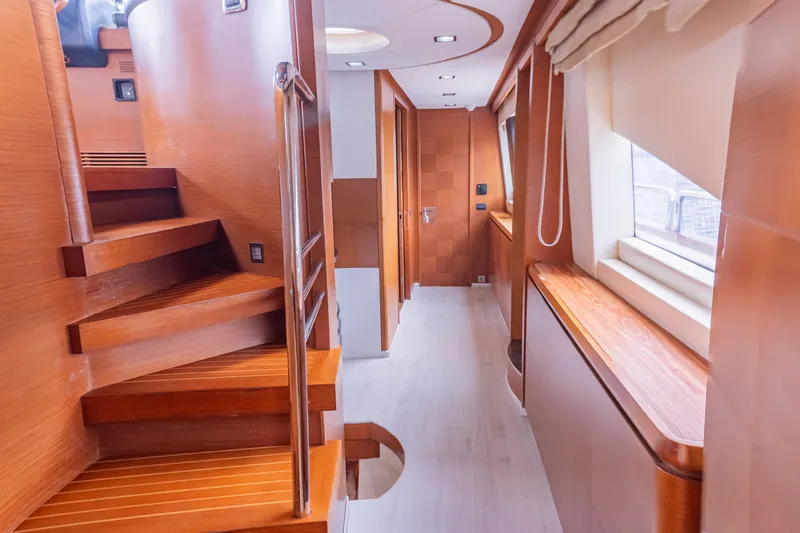 Slide: The Image of Luxurious interior of 2006 Azimut 105 Grande yacht with wooden staircase and modern design. - 12