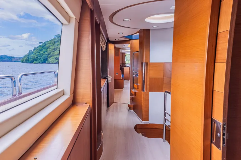 Slide: The Image of Luxurious interior of 2006 Azimut 105 Grande yacht with wooden finishes and scenic window view. - 13