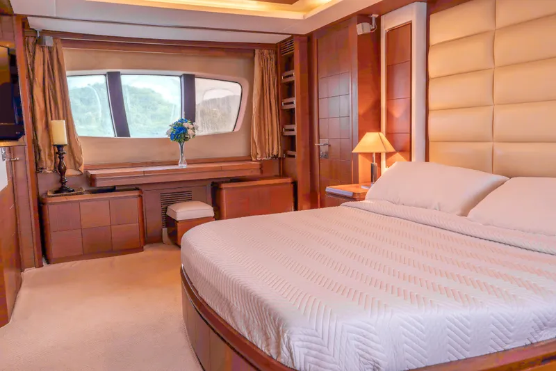 Slide: The Image of Luxurious bedroom interior of 2006 Azimut 105 Grande yacht with elegant furnishings. - 14