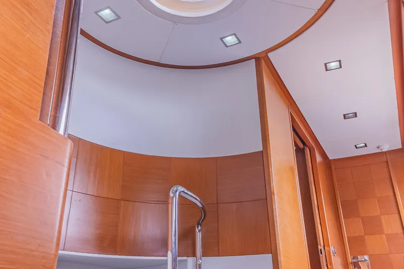 Slide: The Image of Interior of 2006 Azimut 105 Grande yacht with wooden paneling and modern lighting. - 15