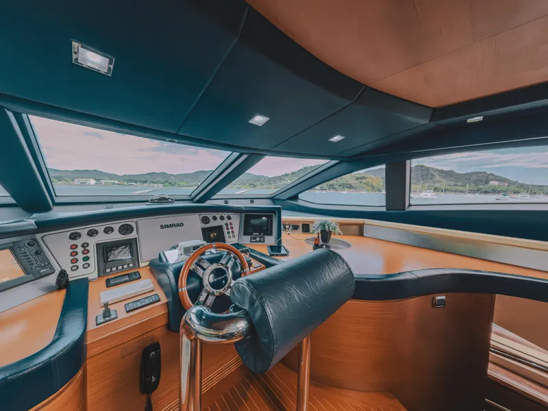 Slide: The Image of Luxurious helm of 2006 Azimut 105 Grande yacht with modern controls and panoramic view. - 17