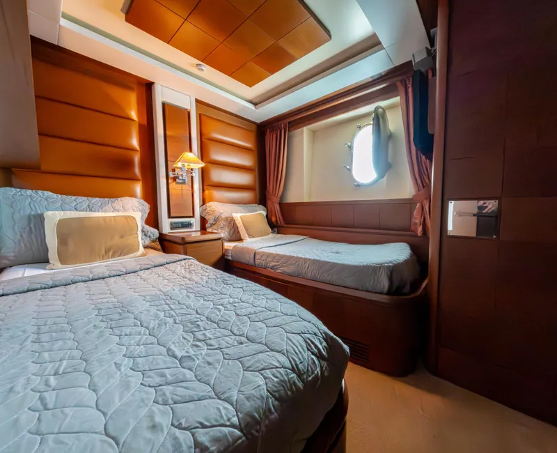 Slide: The Image of Luxurious cabin interior of 2006 Azimut 105 Grande yacht with twin beds and elegant decor. - 18