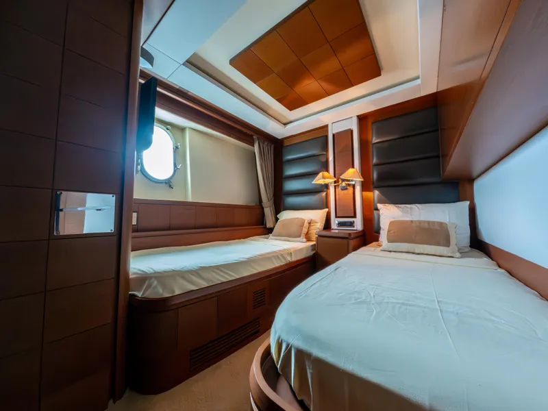 Slide: The Image of Luxurious cabin interior of 2006 Azimut 105 Grande yacht with twin beds and elegant decor. - 19
