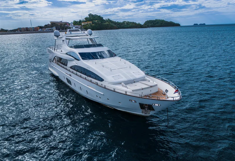 Slide: The Image of Luxurious 2006 Azimut 105 Grande yacht cruising on serene blue waters. - 2