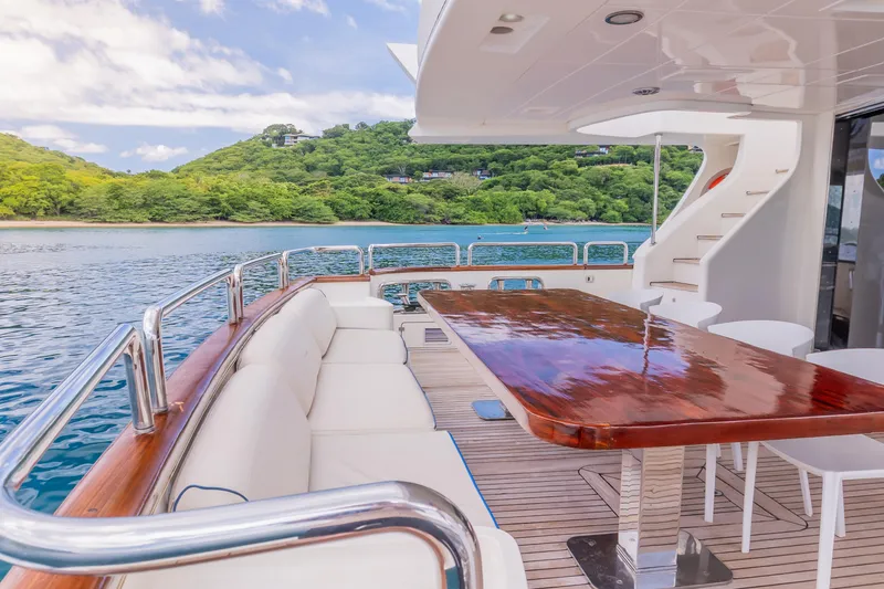 Slide: The Image of Luxurious 2006 Azimut 105 Grande yacht deck with elegant seating and scenic ocean view. - 29