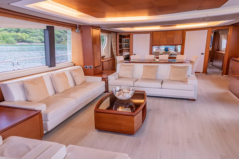 Slide: The Image of Luxurious interior of 2006 Azimut 105 Grande yacht with elegant seating and dining area. - 3