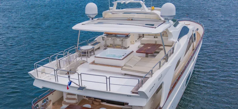 Slide: The Image of Luxurious 2006 Azimut 105 Grande yacht with spacious deck and seating area. - 31