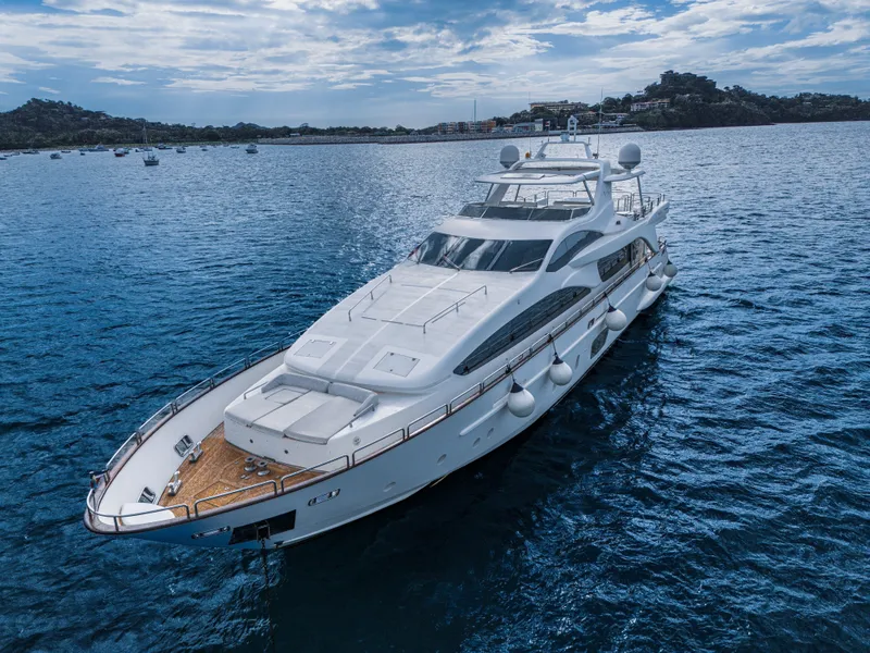 Slide: The Image of Luxury 2006 Azimut 105 Grande yacht cruising on serene blue waters. - 36