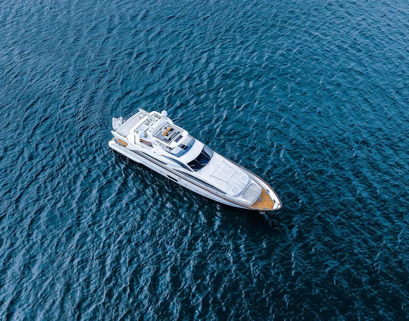 Slide: The Image of Aerial view of 2006 Azimut 105 Grande yacht cruising on open water. - 37