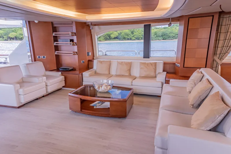 Slide: The Image of Luxurious interior of 2006 Azimut 105 Grande yacht with elegant seating and scenic window view. - 8