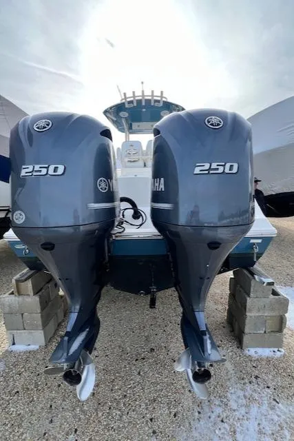 Slide: The Image of 2018 Cobia 277 Center Console with twin Yamaha 250 engines on blocks. - 3
