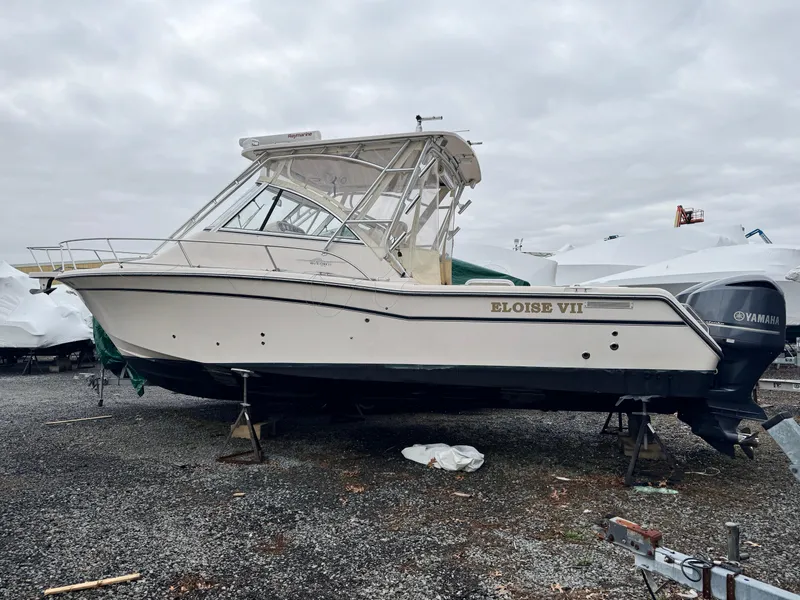 Slide: The Image of 2008 Grady-White Express 305 boat on stands, overcast sky background. - 0