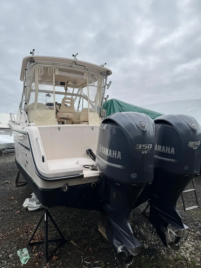 Slide: The Image of 2008 Grady-White Express 305 boat with twin Yamaha 350 V8 engines. - 2