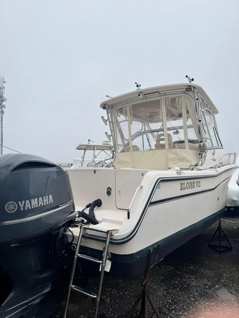 Slide: The Image of 2008 Grady-White Express 305 boat with Yamaha engine, named Eloise VII, on display. - 3