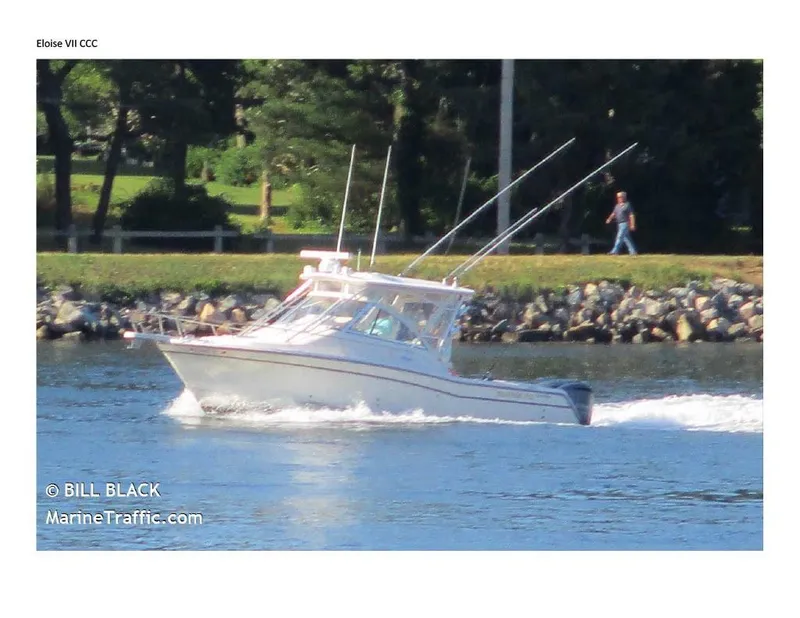 Slide: The Image of 2008 Grady-White Express 305 boat cruising on a river with trees in the background. - 6