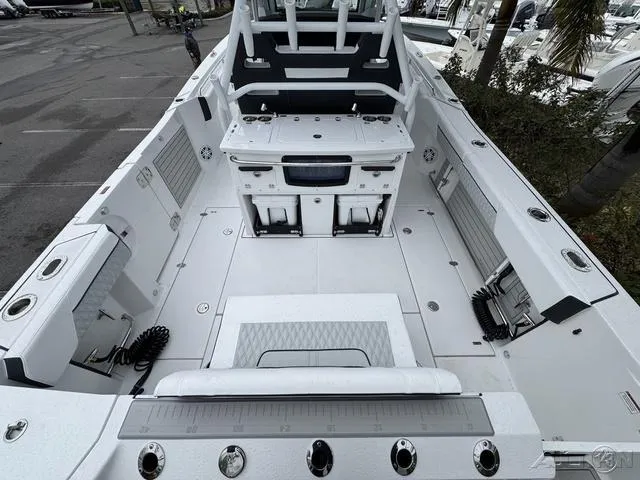 Slide: The Image of 2025 Blackfin 332cc boat interior, spacious deck, modern design, fishing amenities, white finish. - 12