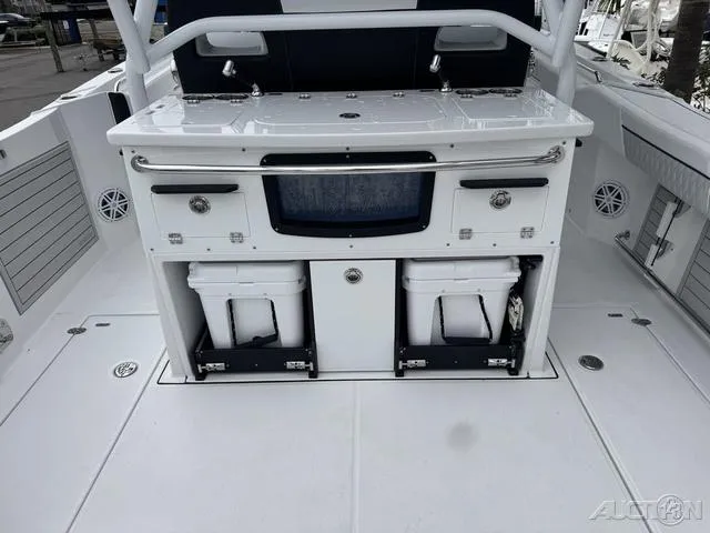 Slide: The Image of 2025 Blackfin 332cc boat interior with storage compartments and seating area. - 15