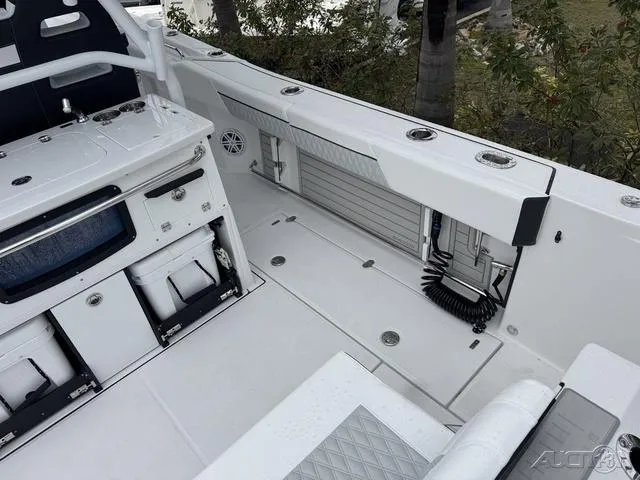 Slide: The Image of 2025 Blackfin 332cc boat interior, featuring storage compartments and sleek design. - 17