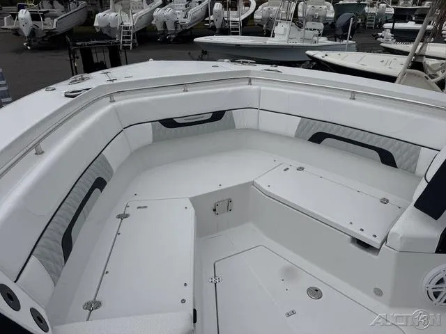 Slide: The Image of 2025 Blackfin 332cc boat interior with white seating and storage compartments. - 28