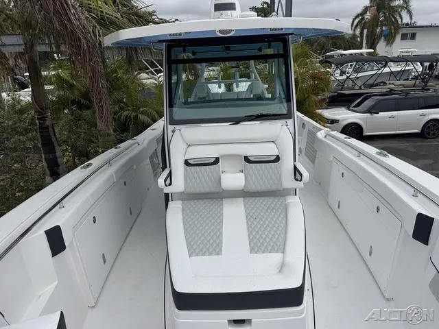 Slide: The Image of 2025 Blackfin 332cc boat with sleek white seating and modern design. - 31