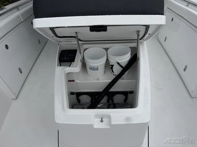 Slide: The Image of 2025 Blackfin 332cc boat storage compartment with open lid, showing organized interior space. - 32