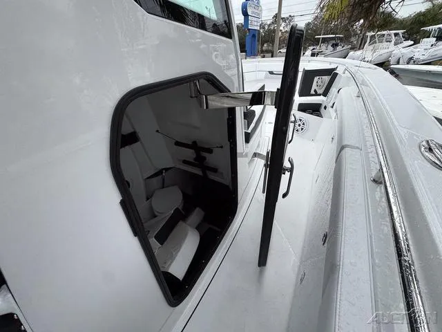 Slide: The Image of 2025 Blackfin 332cc boat with open side hatch, showcasing interior details. - 37