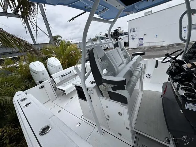 Slide: The Image of 2025 Blackfin 332cc boat interior with seating and dual outboard engines. - 39