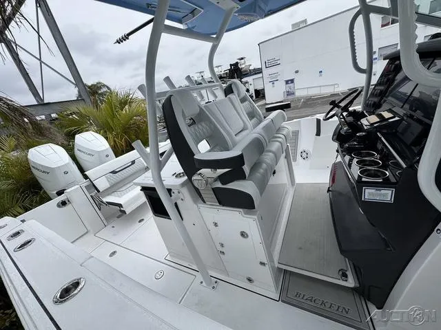 Slide: The Image of 2025 Blackfin 332cc boat interior with seating and control panel, featuring modern design elements. - 41