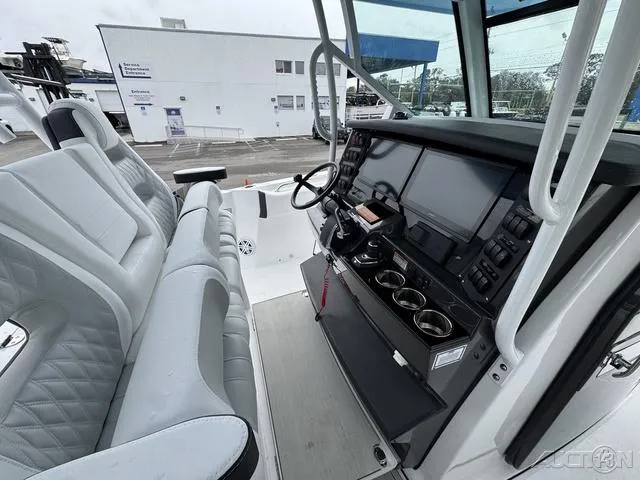 Slide: The Image of 2025 Blackfin 332cc boat cockpit with modern controls and comfortable seating. - 43
