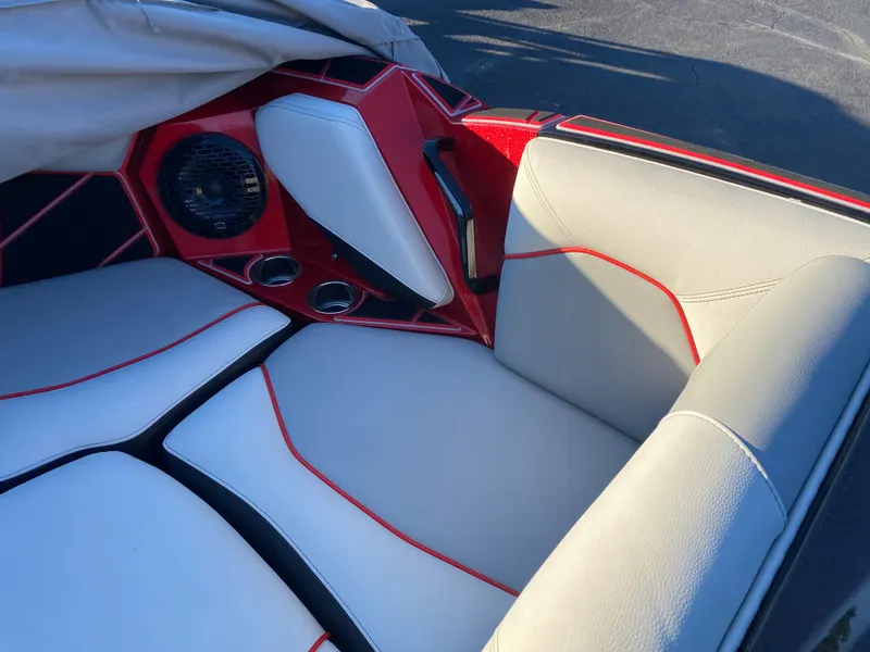 Slide: The Image of 2023 Centurion Fi23 boat interior with red and white upholstery and speaker system. - 10
