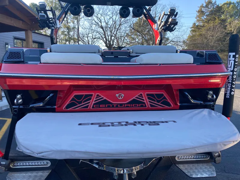 Slide: The Image of 2023 Centurion Fi23 boat, rear view with red detailing and seating. - 3