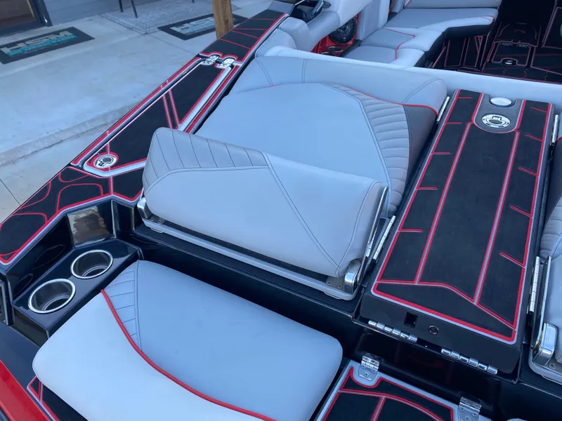 Slide: The Image of 2023 Centurion Fi23 boat interior with sleek gray and red upholstery design. - 6