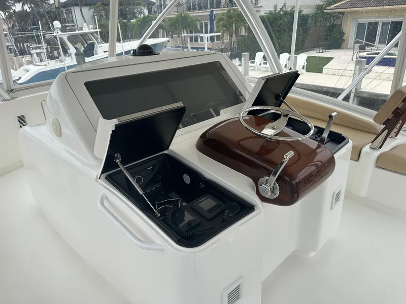 Slide: The Image of 2017 Viking 55 Convertible yacht helm with advanced navigation controls. - 1