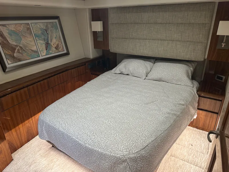 Slide: The Image of Luxurious bedroom interior of 2017 Viking 55 Convertible yacht with modern decor. - 10