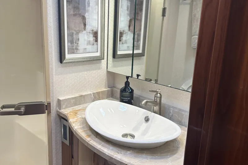 Slide: The Image of Elegant bathroom interior of 2017 Viking 55 Convertible yacht with modern sink and decor. - 11