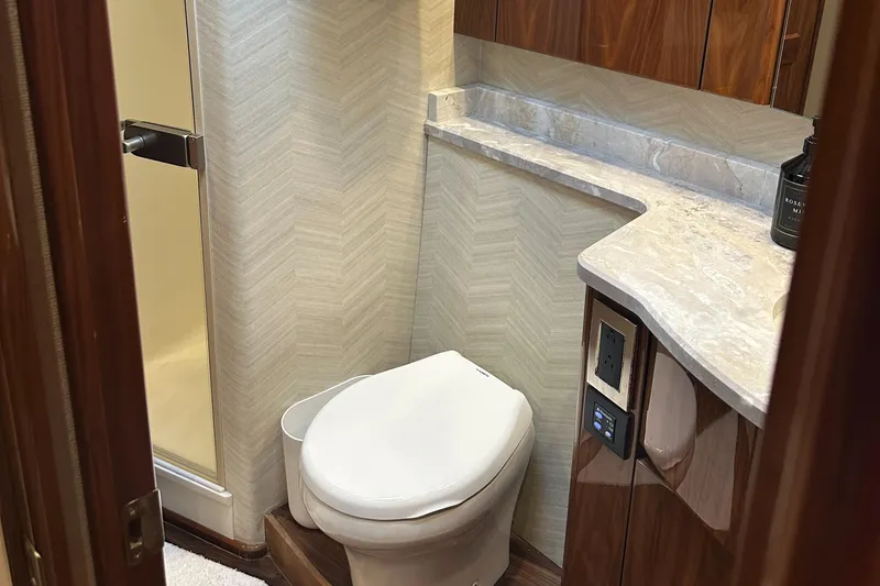 Slide: The Image of Bathroom interior of 2017 Viking 55 Convertible yacht with modern fixtures. - 15