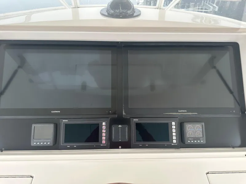 Slide: The Image of Control panel of a 2017 Viking 55 Convertible yacht with dual Garmin displays. - 23