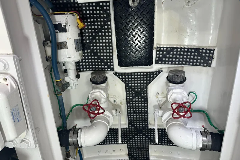 Slide: The Image of Engine room of 2017 Viking 55 Convertible yacht, showing plumbing and mechanical components. - 35