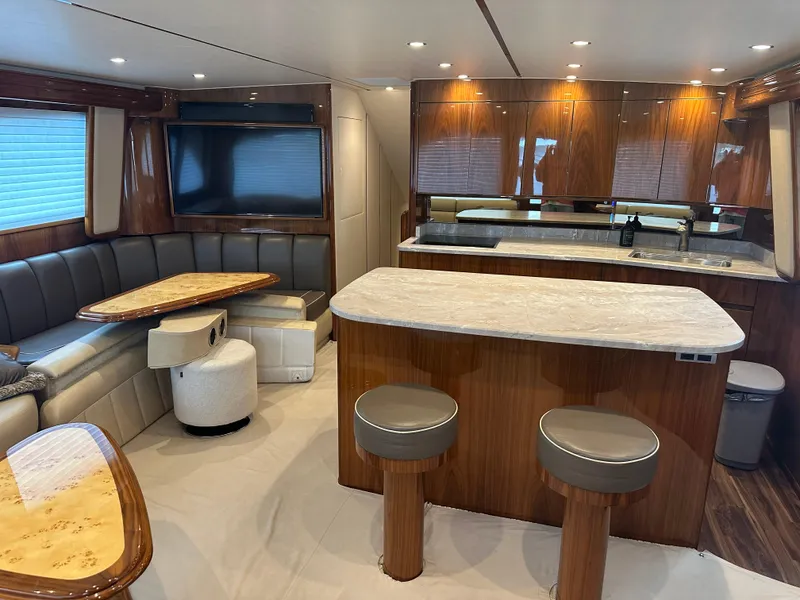 Slide: The Image of Luxurious interior of 2017 Viking 55 Convertible yacht with modern kitchen and seating area. - 6