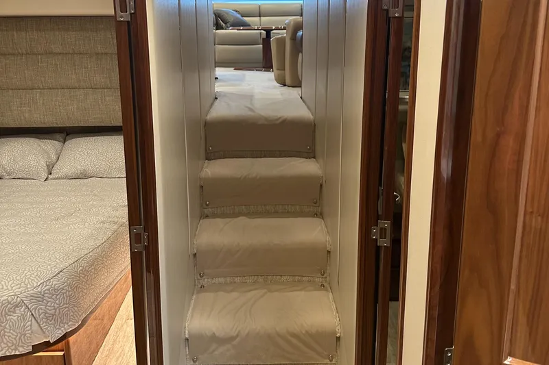 Slide: The Image of Interior of 2017 Viking 55 Convertible yacht with stairs and cabin view. - 9