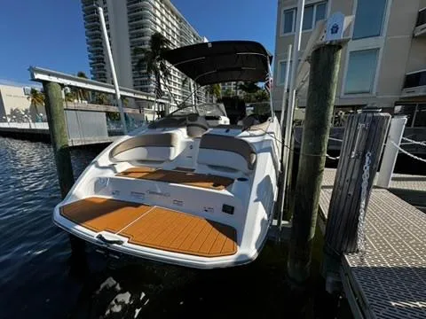 Slide: The Image of 2011 Yamaha Boats SX240 HO docked, featuring spacious seating and sleek design. - 2