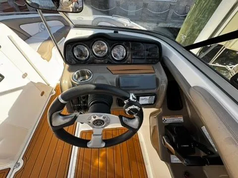 Slide: The Image of 2011 Yamaha Boats SX240 HO dashboard with steering wheel and gauges. - 7
